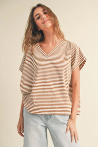 A soft loose-fitting v-neck striped pattern short sleeve top in beige and brown horizontal stripes