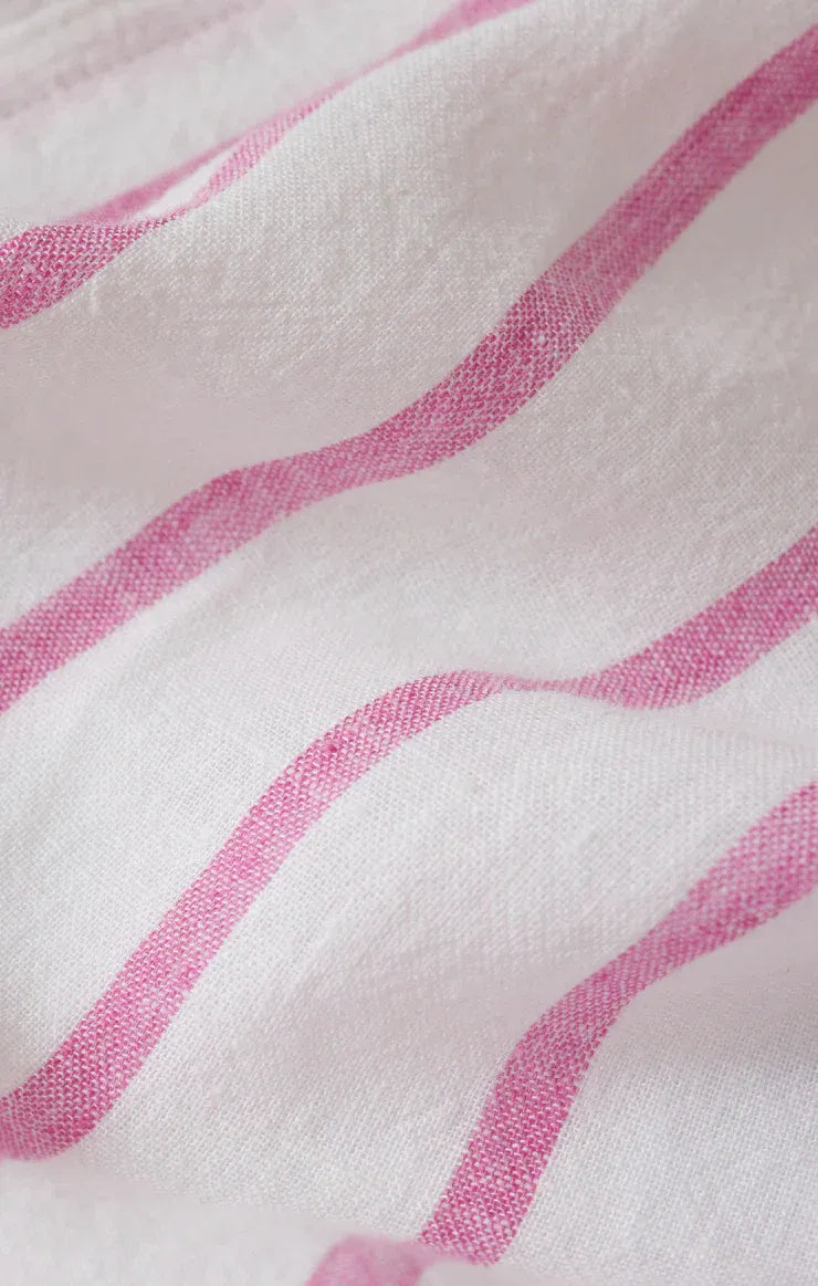 The perfect linen striped top features soft white fabric with delicate pink wavy stripes in linen striped design