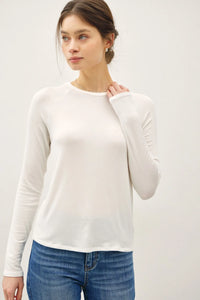A soft white modal raglan sleeve layering basic top with long sleeves and subtle ruching along the sleeves