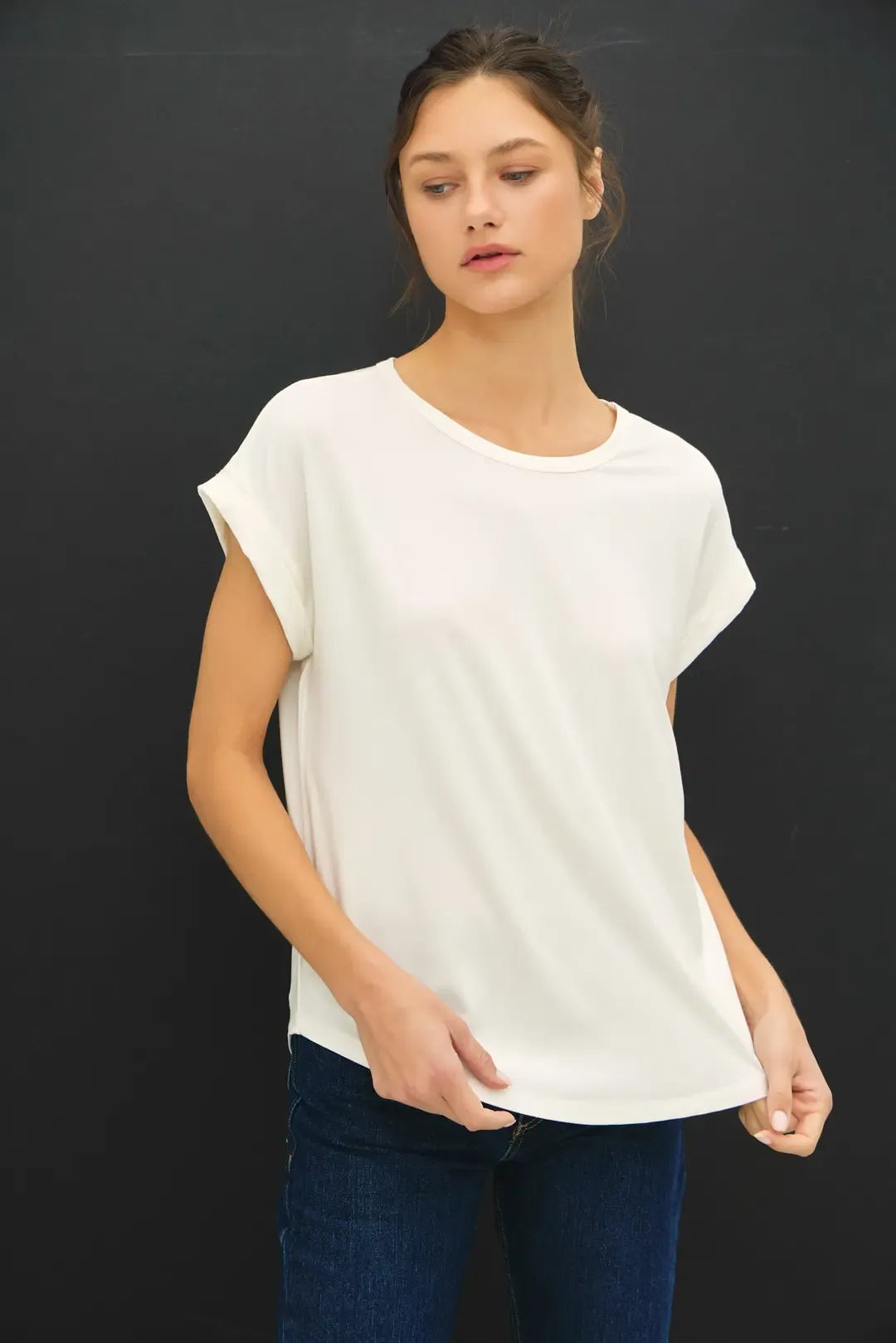 A soft white bamboo round neck cap sleeve top with a relaxed fit and rounded neckline for casual wear