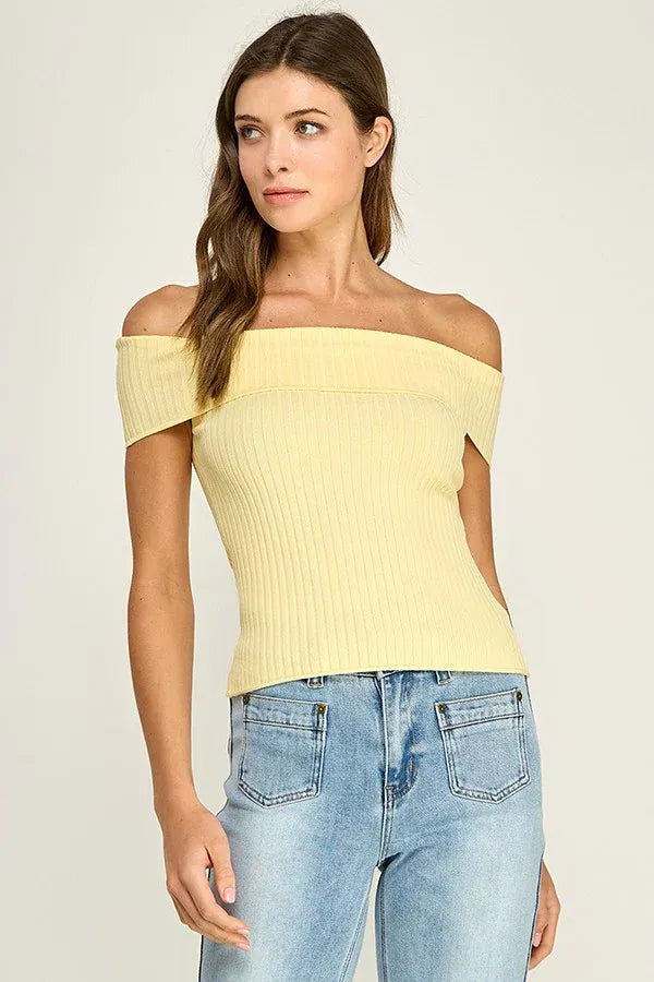 A soft yellow ribbed fitted off shoulder top with short sleeves made from knit fabric for a stylish look