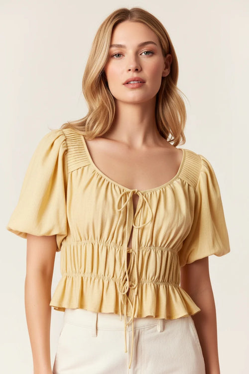 Soft yellow short-sleeved open bow tie top with pleated shirring