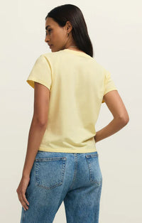 A soft yellow shine tourist tee shirt with short sleeves and a simple round neckline for casual wear