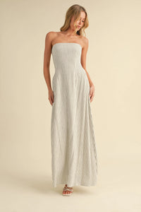Cream strapless maxi dress with thin black vertical stripes and long back tie in soft fabric