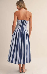 Strapless striped pleated flared midi dress in navy blue and light gray with fitted bodice and flowing skirt