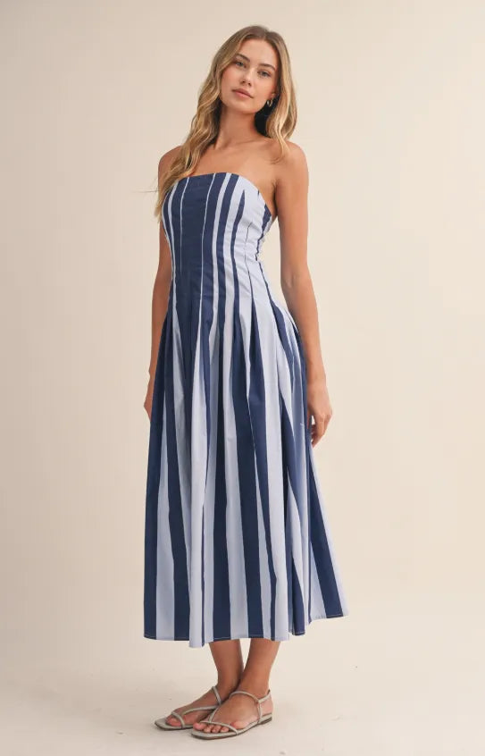 Strapless striped pleated flared midi dress in navy and light blue vertical stripes with lightweight flowing fabric