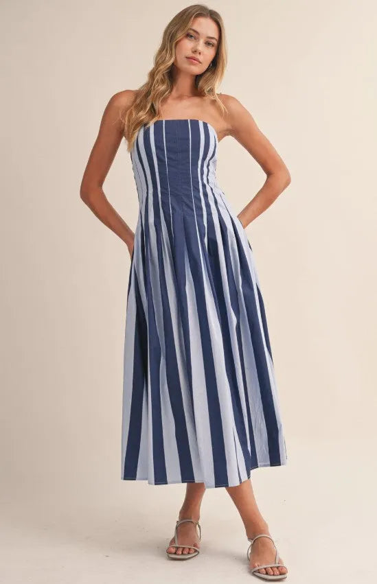A strapless striped pleated flared midi dress in navy and light blue with lightweight fabric and waist pleats