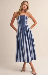 A strapless striped pleated flared midi dress in navy and light blue with lightweight fabric and waist pleats
