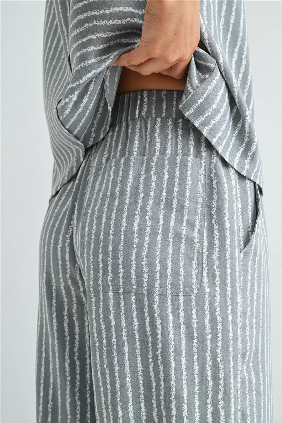Gray and white vertically striped soft flowing stripe straight leg elastic pants for comfortable loungewear purposes