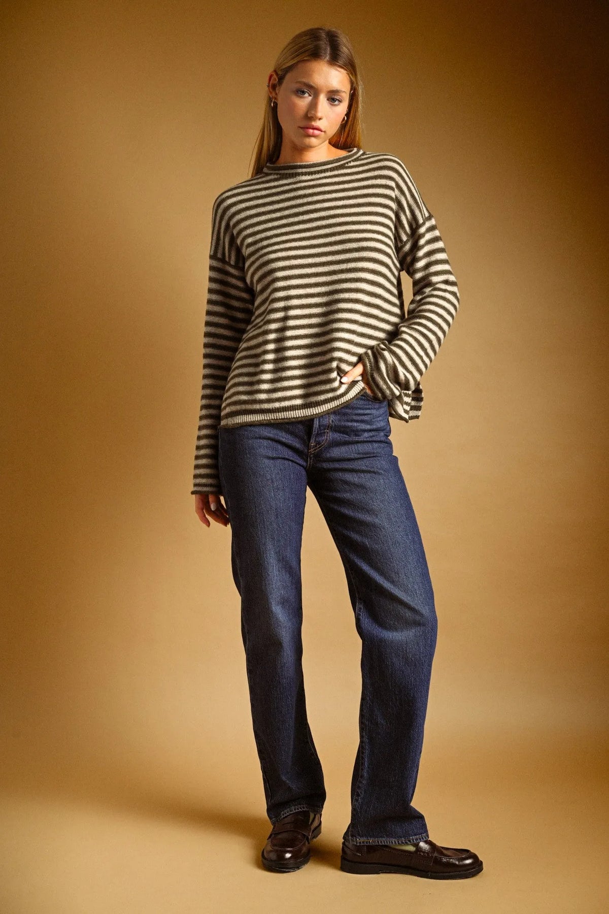 Striped pattern rolled neck sweater in black and beige knit with a relaxed fit and long sleeves