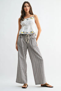 Striped wide leg linen blend pants in soft gray and white with vertical stripes, drawstring waist, and side pockets
