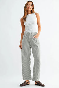 Striped wide leg trousers in black and white vertical pattern made from soft cotton blend with front pleats for a stylish barrel fit