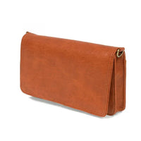 Tan leather billie mini organizer crossbody bag with subtle texture and gold-toned metal clasp for stylish use