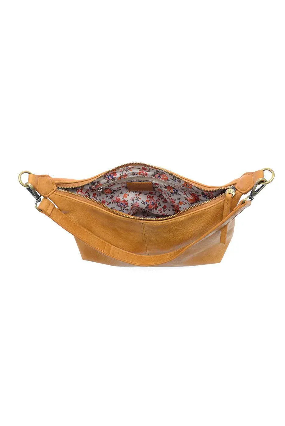 Tan leather danna top zip crossbody bag with floral interior lining perfect for women’s boho chic clothing shop daisy