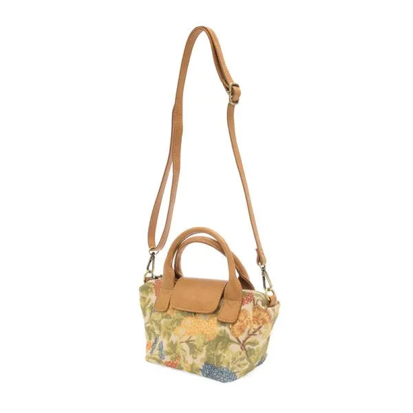 Abilene canvas mini tote crossbody featuring a beige floral canvas body with tan leather strap and handles