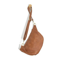 Tan suede rory organizer sling belt bag with single adjustable strap and gold-tone hardware for hands-free use