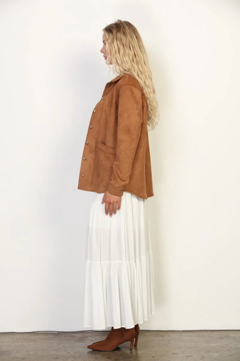A tan classic western suede shacket with gold toned buttons and a relaxed fit in suede material
