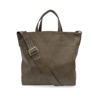 A taupe suede alma buckle tote with a detachable strap and brass buckle for versatile everyday use