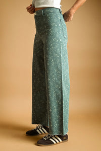 Teal floral print stretched wide leg denim pants with frayed hems designed as stylish wide leg pants