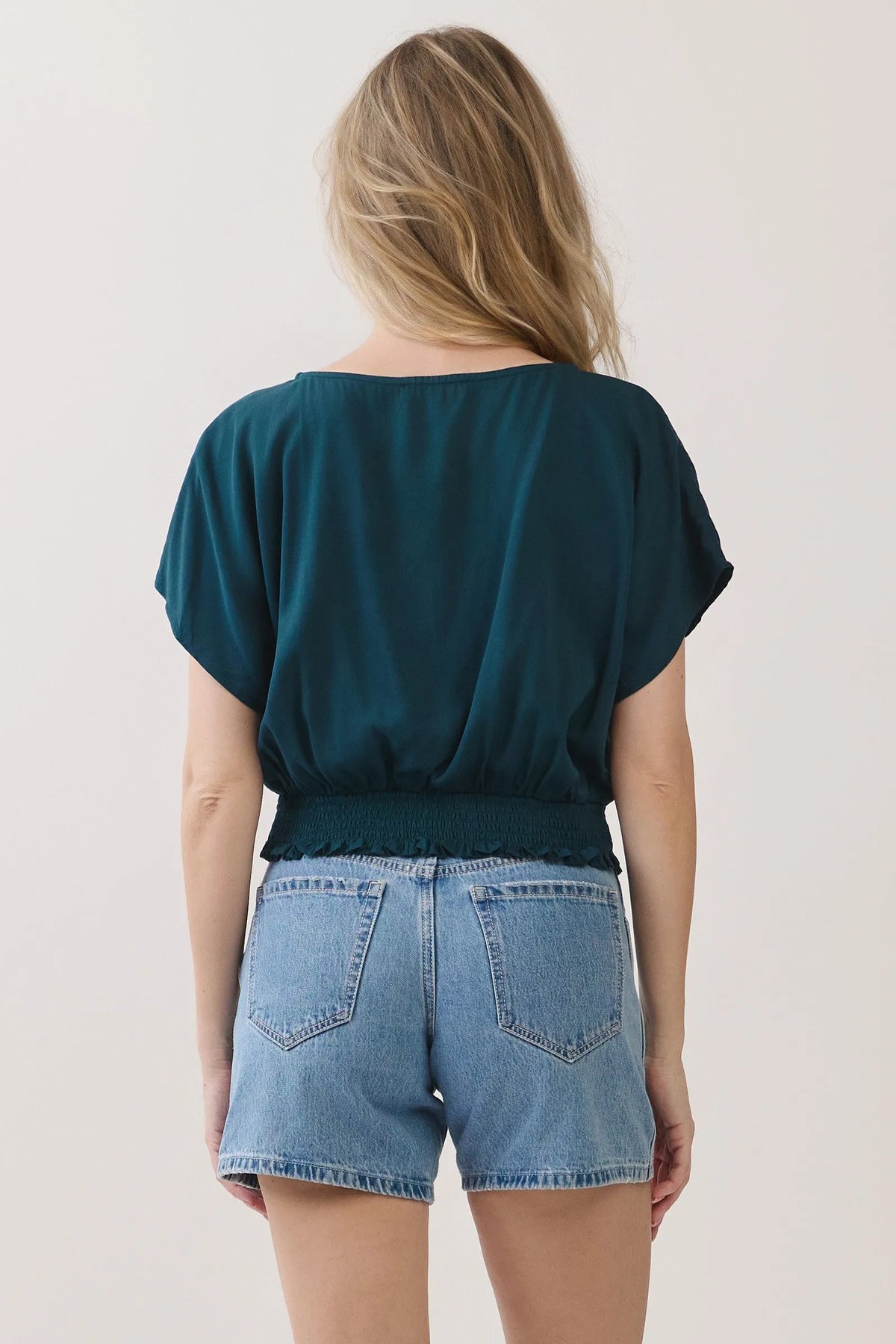 Teal short-sleeved neck button detailed blouse with gathered waistband and ruffled hem for casual wear