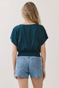Teal short-sleeved neck button detailed blouse with gathered waistband and ruffled hem for casual wear