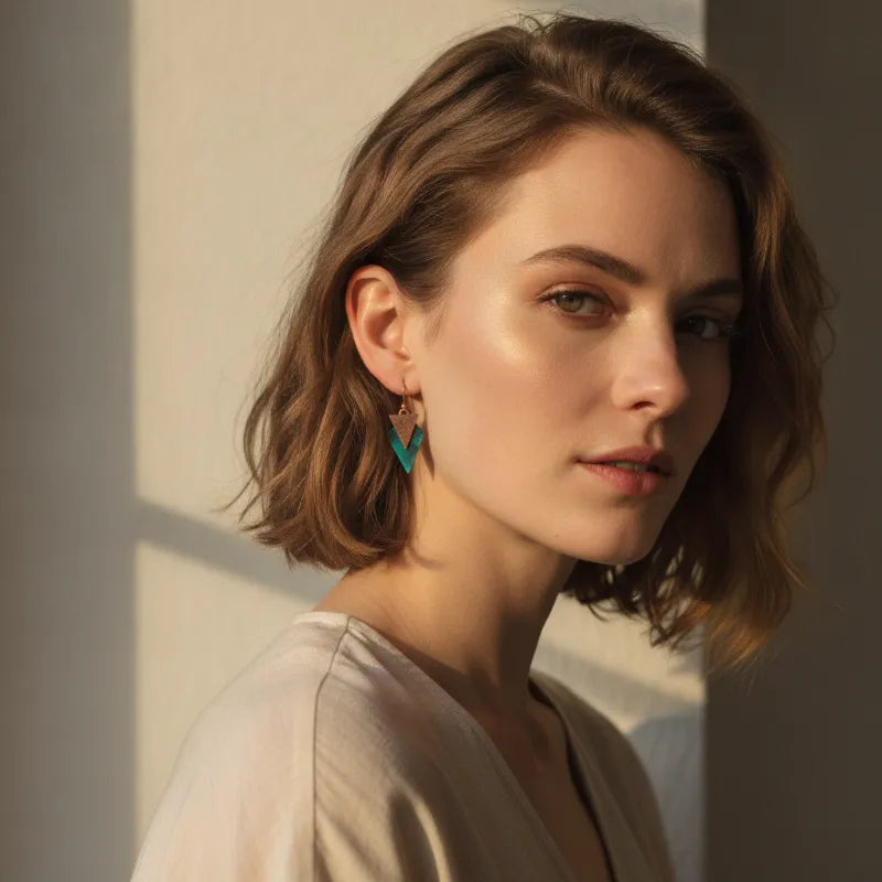 Teal geometric drop earrings with rustic copper patina and gold-tone hooks for chic handmade style