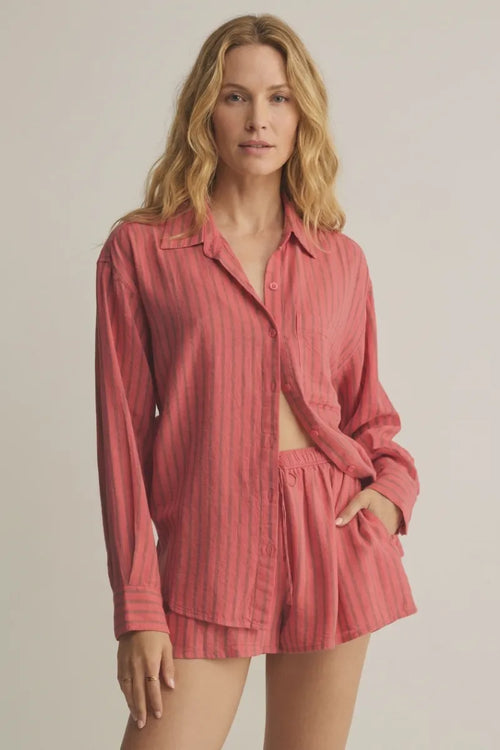 A soft coral-colored perfect striped linen button-up shirt with vertical stripes, relaxed fit, and rolled sleeves