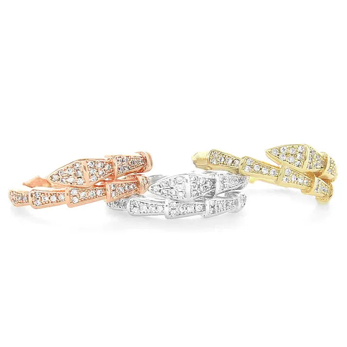 Three cubic zirconia patterned rings in rose, white, yellow gold