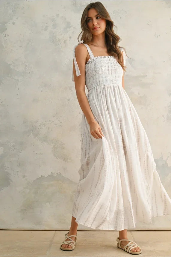 Boho chic women’s maxi dress with smocked bodice and tie-dye print