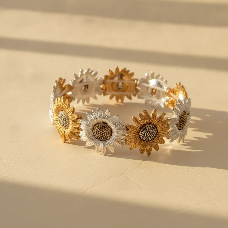 Two-tone sunflower statement bracelet with alternating gold and silver floral links featuring detailed centers