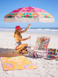 A vibrant floral-patterned double sided microfiber beach towel featuring a favorite color design with pink green blue and yellow blossoms