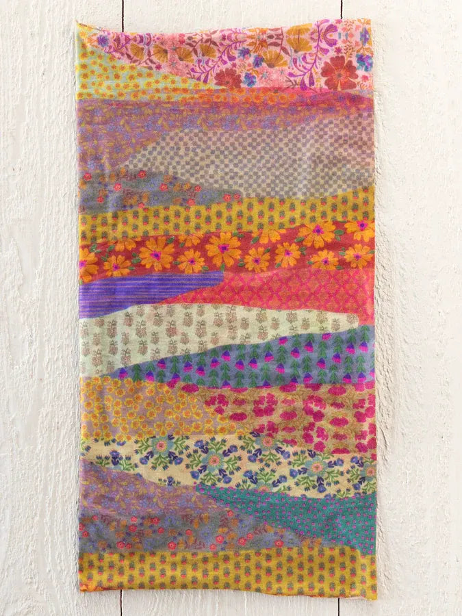 A vibrant boho bandeau headband full of garden waves patterns in bright floral and geometric patchwork colors