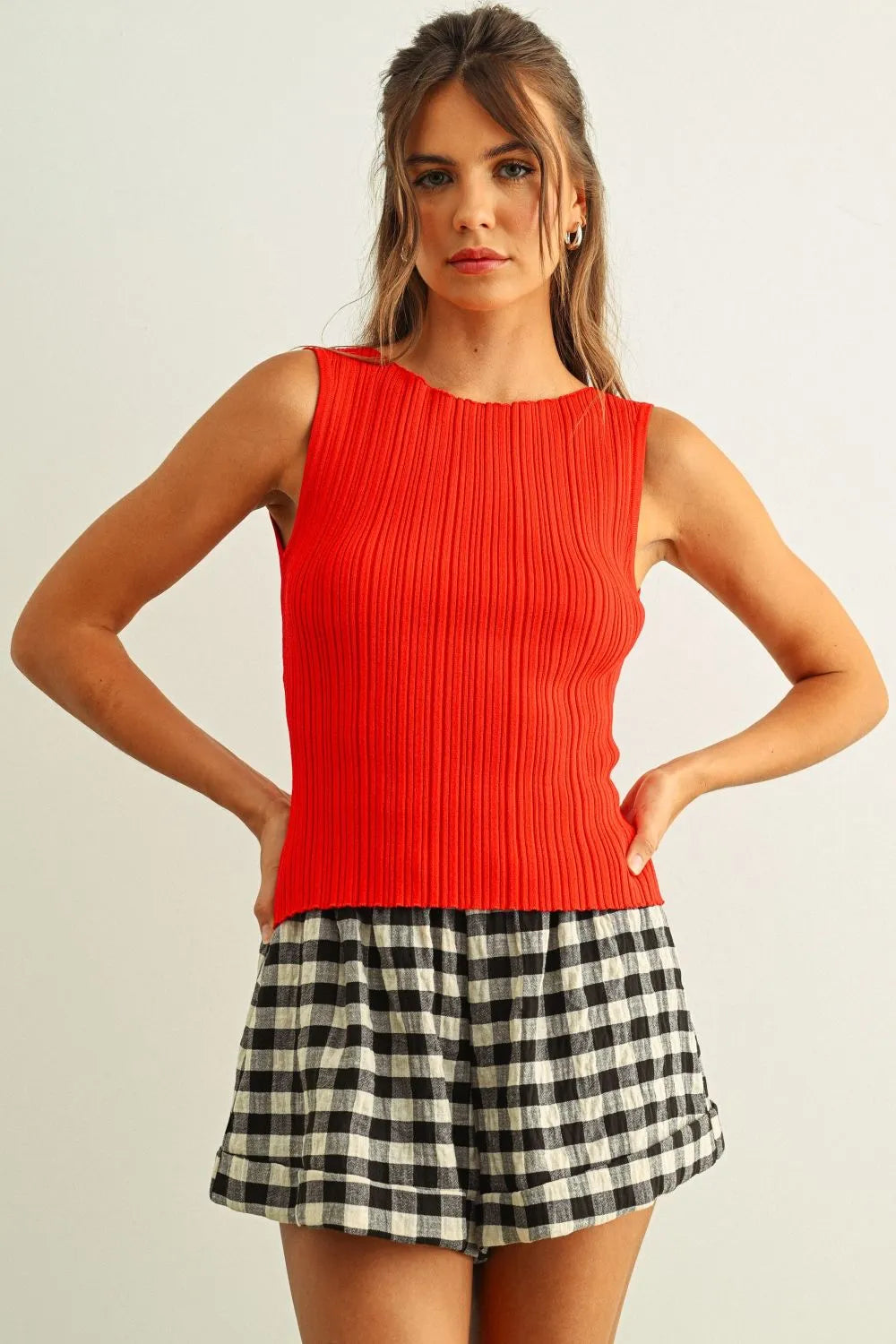 Vibrant red viscose ribbed knitted sleeveless top with flattering fit perfect for boho chic clothing styles