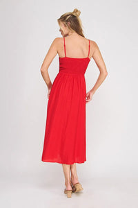 A vibrant red sleeveless midi dress with a smocked bodice and thin straps, perfect as a bodice maxi dress