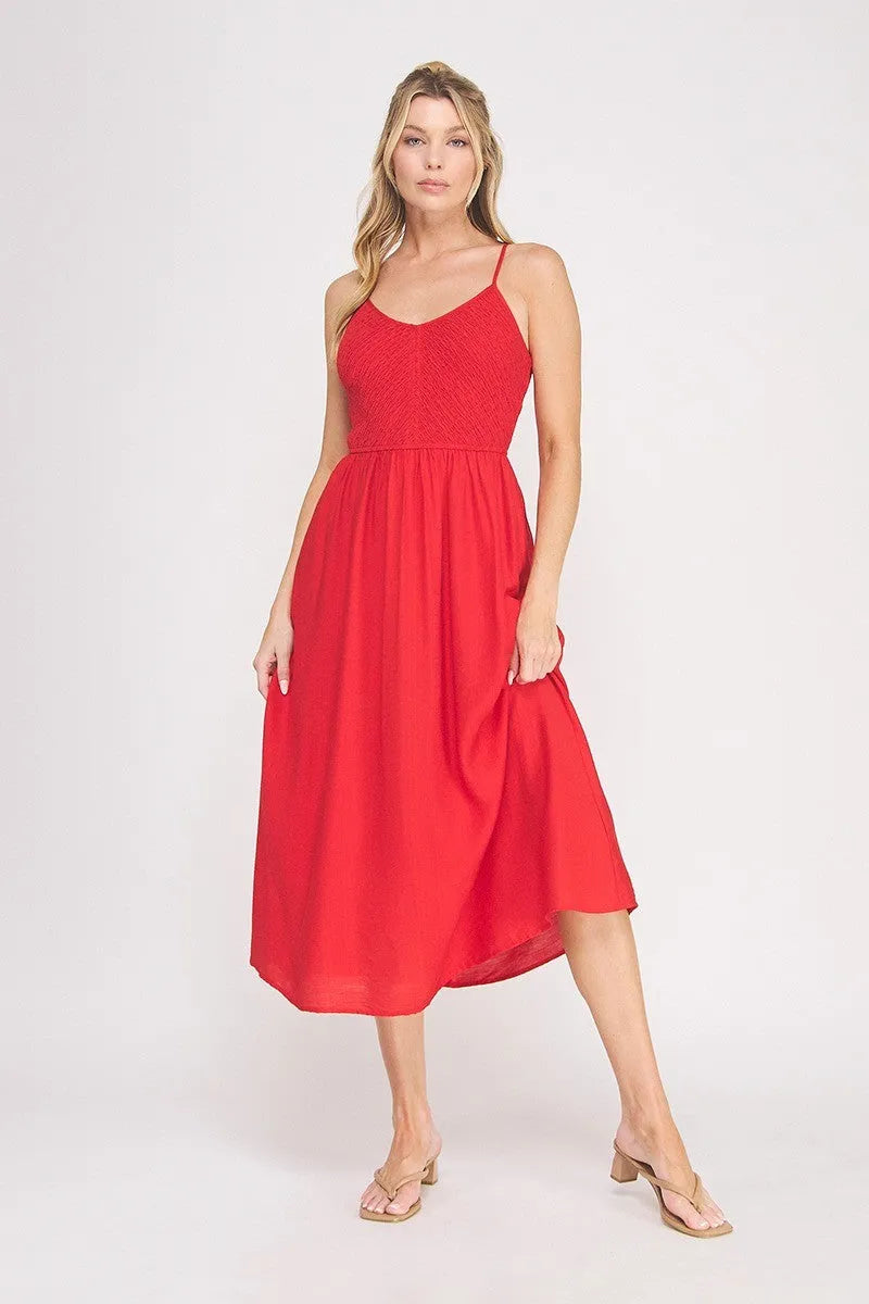 A vibrant red sleeveless midi dress with a smocked bodice and flowing skirt bodice maxi dress