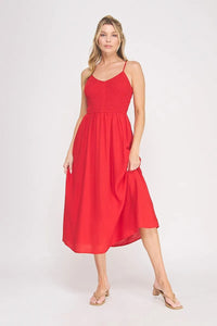 A vibrant red sleeveless midi dress with a smocked bodice and flowing skirt bodice maxi dress