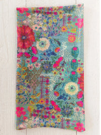 Full boho bandeau headband in vibrant teal with colorful floral garden patchwork design for stylish wear