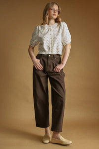 White polka dot short sleeve cardigan with small gray dots and puffed sleeves in soft fabric