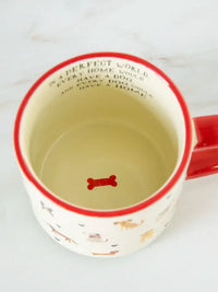White ceramic bungalow mug with red rim and handle featuring colorful dog pattern for shop daisy and women’s boho chic clothing
