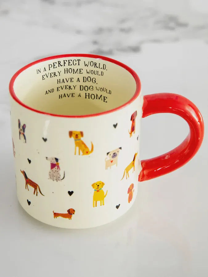 White ceramic bungalow mug with red handle and rim featuring colorful cartoon dogs and black hearts shop daisy