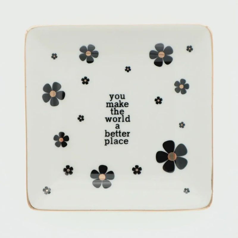White ceramic trinket tray with black floral decals and gold rim featuring you make the world a better place text, shop daisy