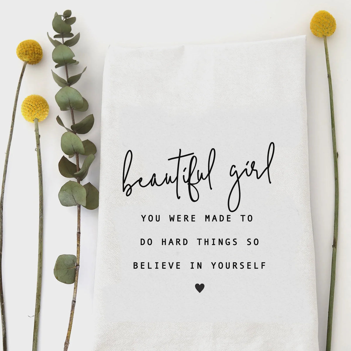 White cotton beautiful girl tea towel with black cursive and block lettering and heart design