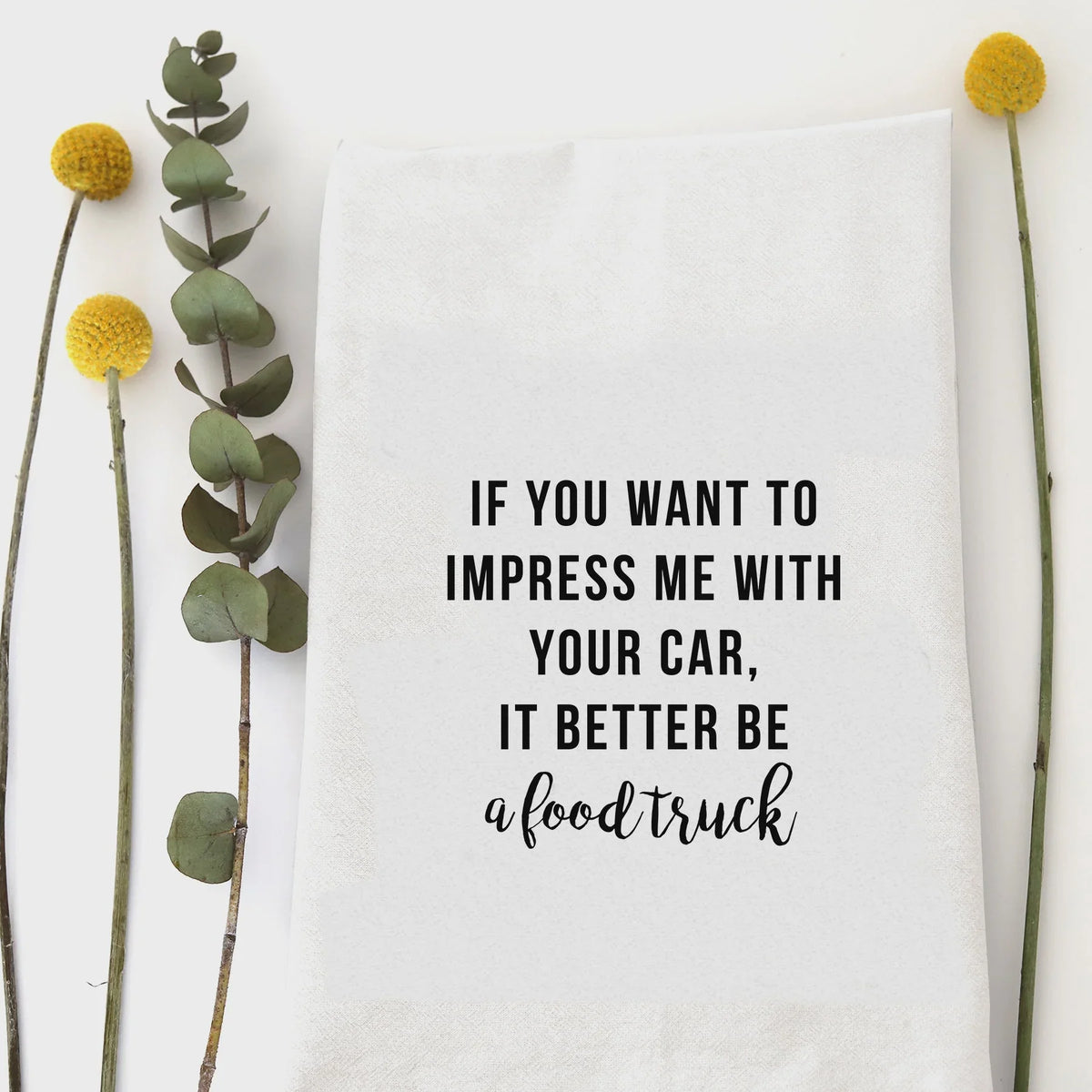 White cotton kitchen tea towel with Impress Me Food Truck quote