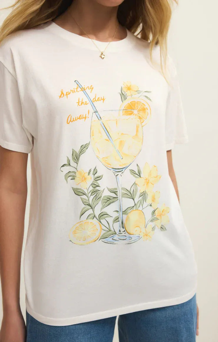 White cotton spritz boyfriend tee featuring a vibrant watercolor lemon cocktail graphic with citrus and flowers