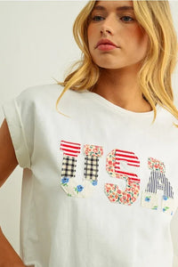 White cotton t shirt with usa floral patchwork design featuring red white and blue floral patterns on front