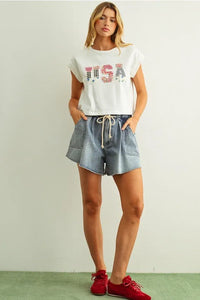 White cropped sleeveless top with usa floral patchwork red white and blue sequin lettering front design
