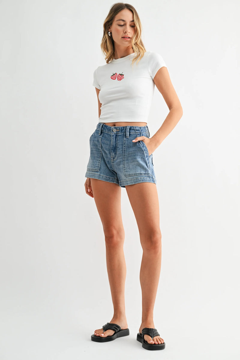White cropped t-shirt with red heart on high rise trouser denim short