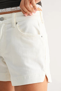 White low rise slit lightweight short denim shorts with subtle texture silver hardware and tailored fit