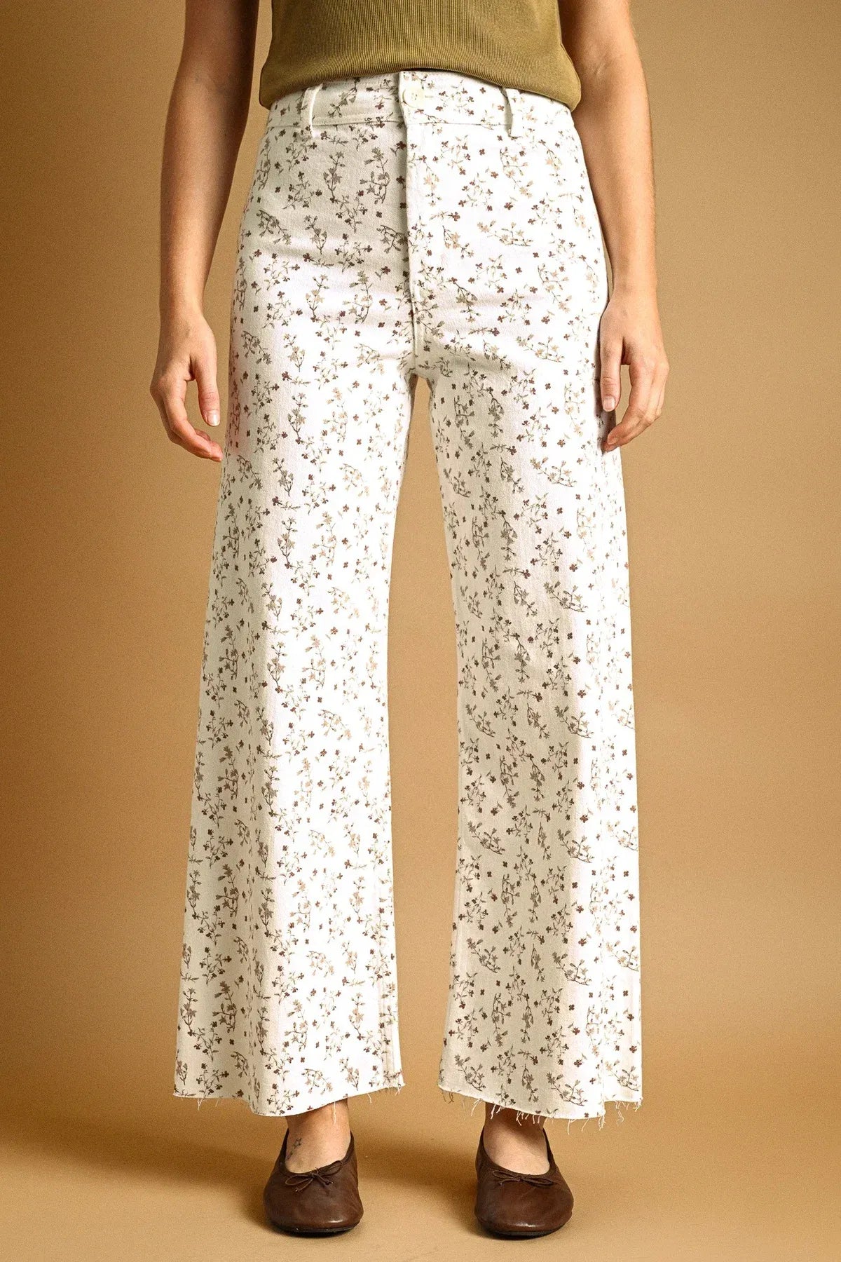 White denim floral print stretched wide leg pants with high waist and delicate muted floral pattern