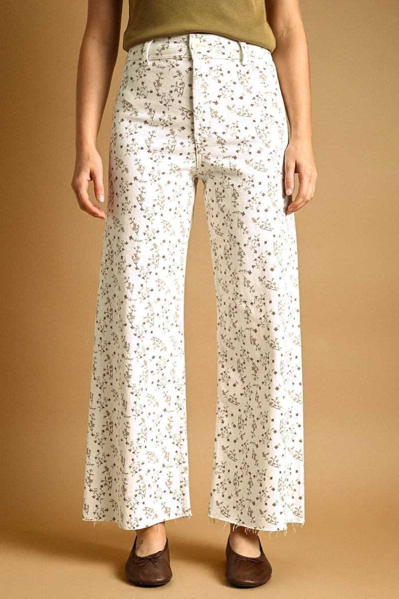 White denim floral print stretched wide leg pants with high waist and delicate muted floral pattern